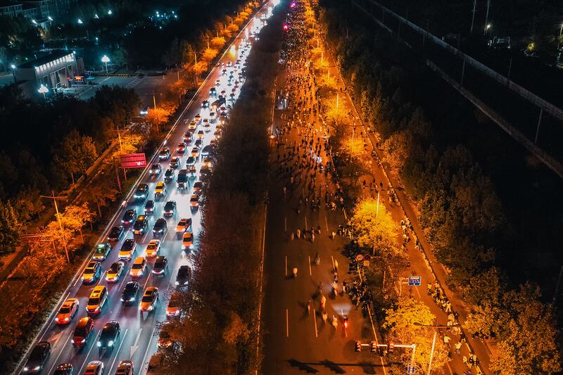 Thousands of college students ride bicycles on the Zhengkai Road in Zhengzhou, in China's Henan province, Nov. 9, 2024.